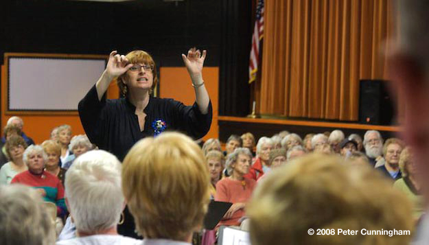 Sharon Crowther directs the mass choir for an appreciative audience