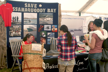 People at the Save Passamaquoddy Bay booth